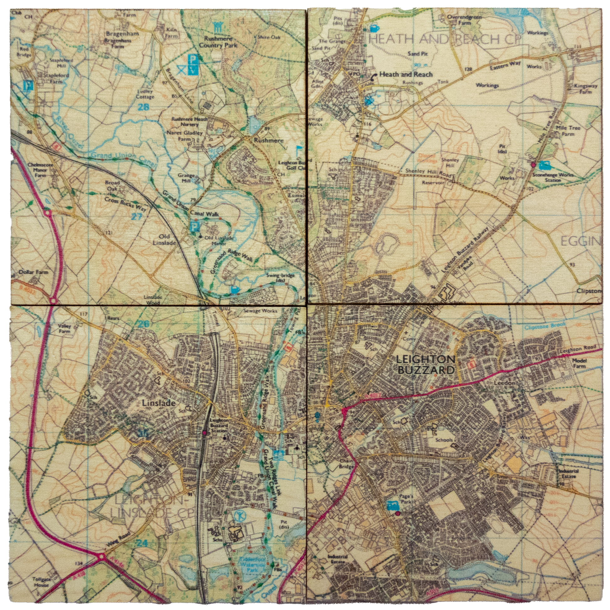 Drinks coaster set of dipicting a ordanace survey map of Leighton Buzzard & surrounding area placed together like a jigsaw in this photo