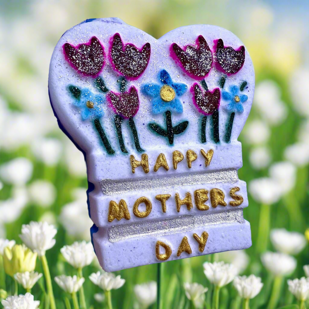 A mother's day gift bath bomb with flowers and inscription saying "happy mother's day"