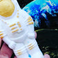 White & Gold vegan bath bomb in shape of a spaceman with hidden colours