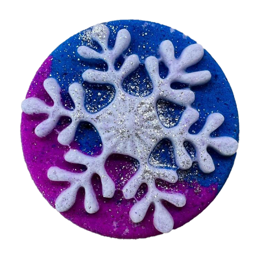 Festive Bath Bomb in the shape of a snowflake with bright colours and sprinkling of biodegradable glitter