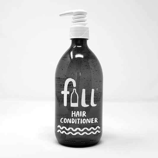 Screen Printed amber glass bottle containing vegan hair conditioner suitable for curly hair method