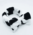 Fluffy hair band to keep hair out of your eyes when applying make-up or facemasks in cow print