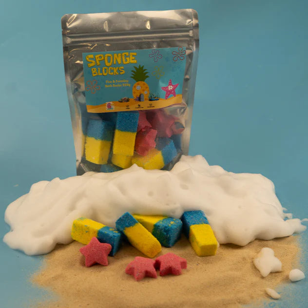 A pack of Blue & Yellow bath bombs, with a pineapple & tropical beach scene on the label