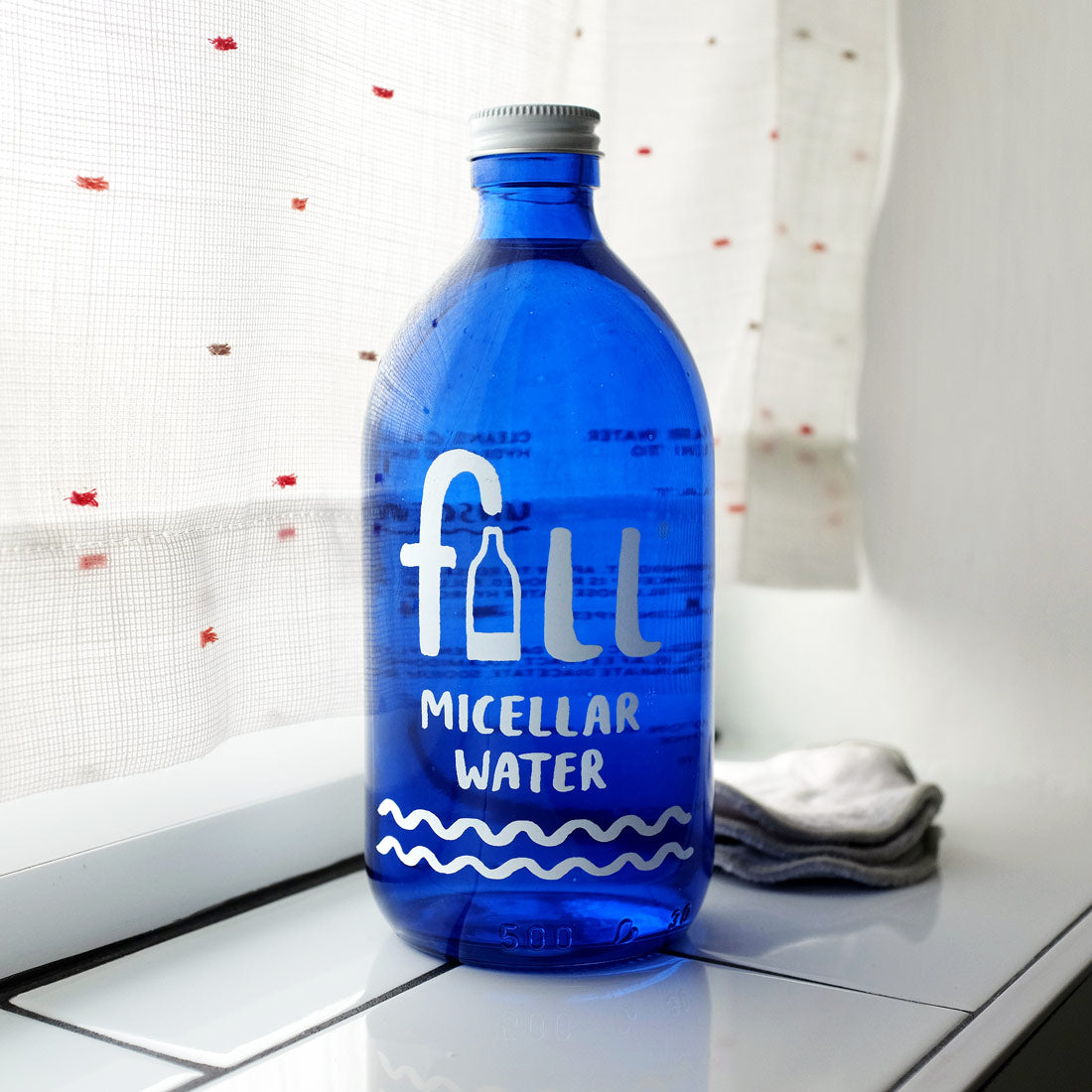 Micellar Water in Blue Glass Bottle