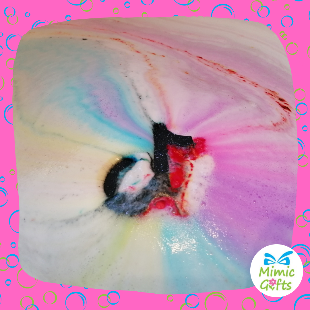 Tiktok bathbomb creating a rainbow effect in the bath