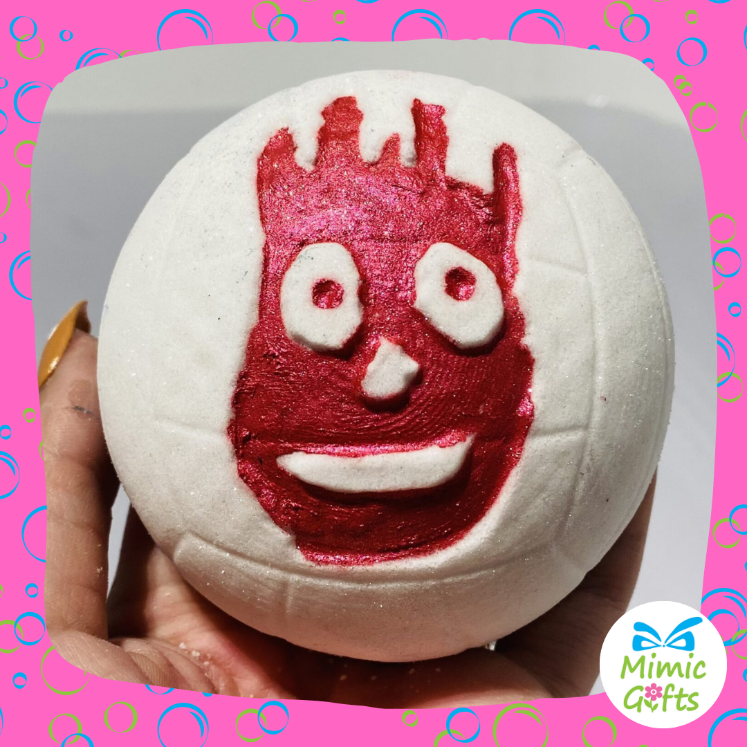 A white football shaped bath bomb with Winston, character from the film castaway depicted in red 